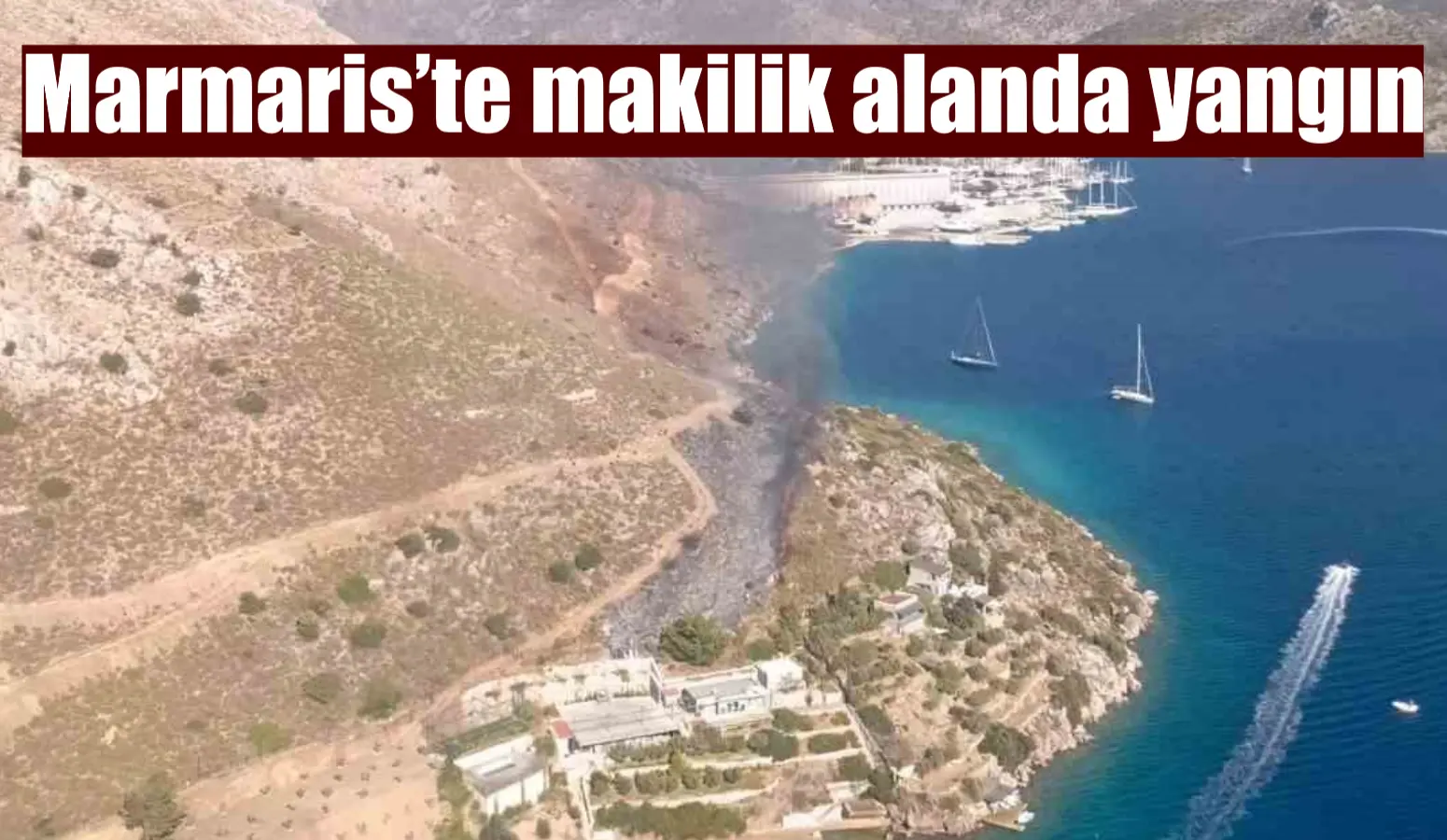 Muğla’nın Marmaris ilçesinde otluk ve makilik alanda çıkan yangın, ekiplerin