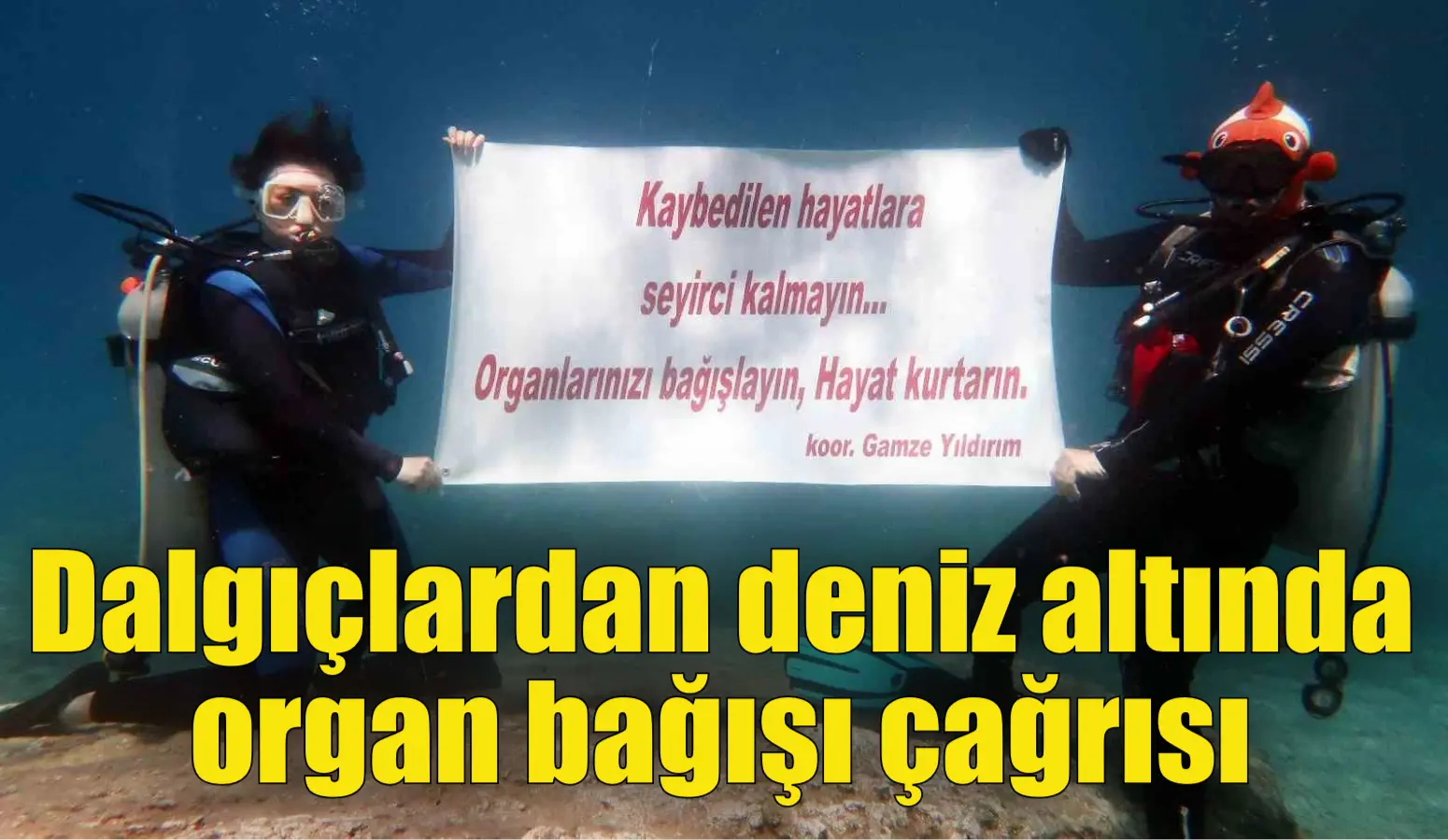 Muğla’nın Fethiye ilçesinde dalgıçlar, deniz altında açtıkları pankartla organ bağışının