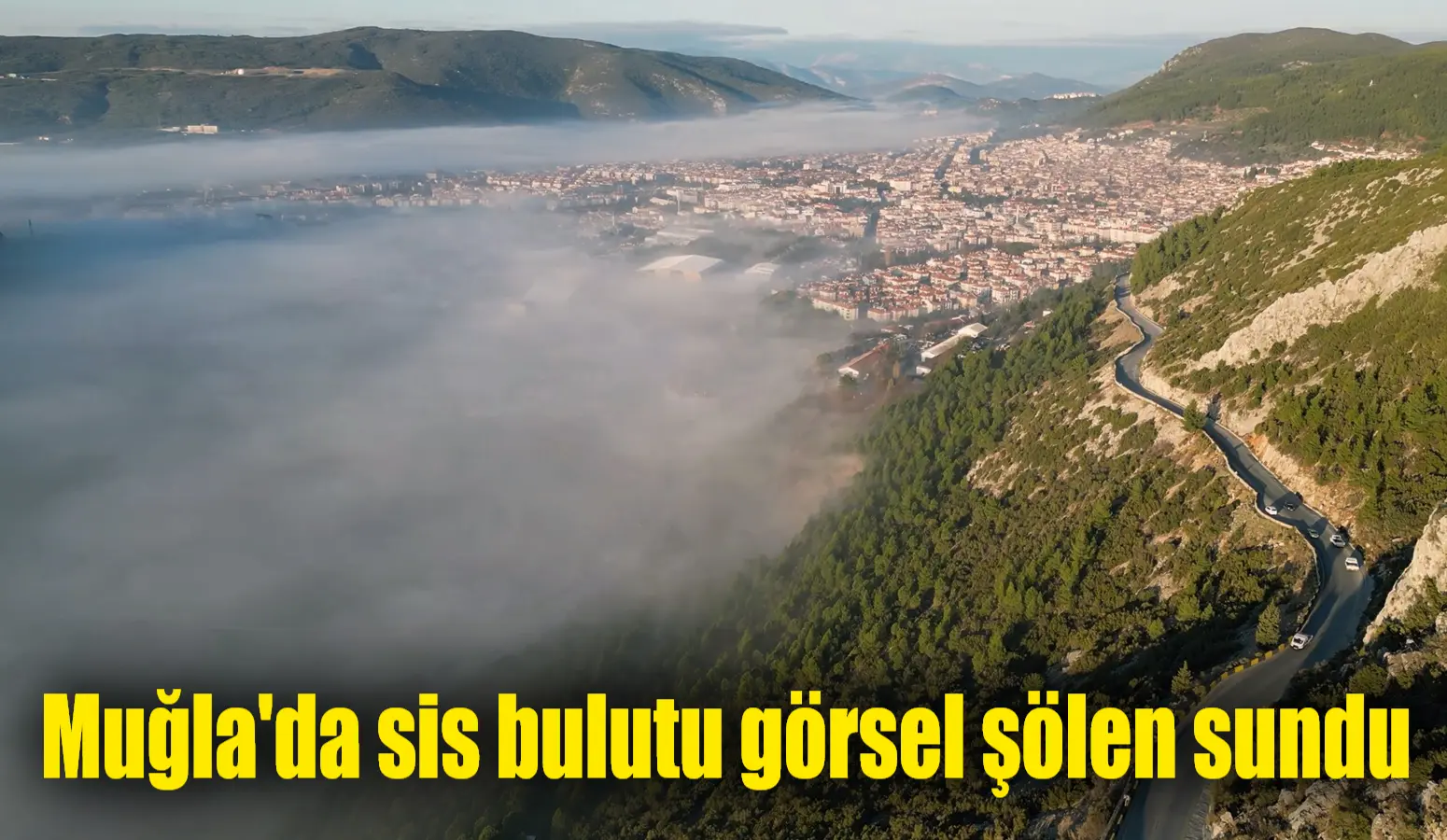 Muğla'nın Menteşe ilçesi sabah saatlerinde sis bulutu içinde adeta kaybolurken,