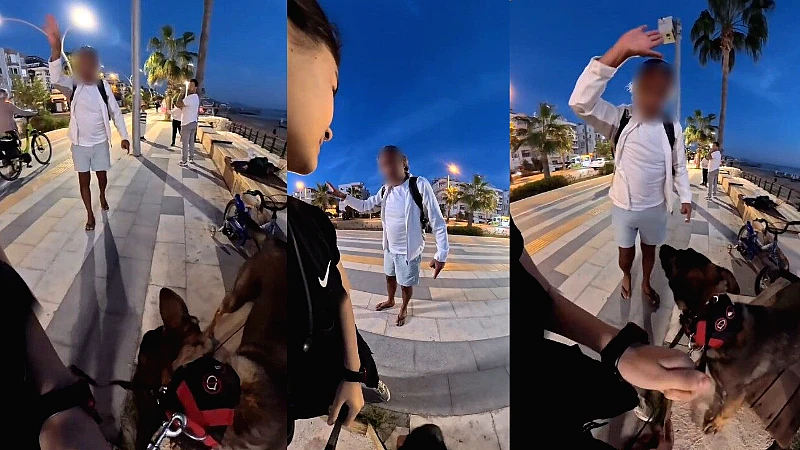 Antalya'nın Alanya ilçesinde bankta köpeğiyle oturan yerleşik yabancı bir kız,