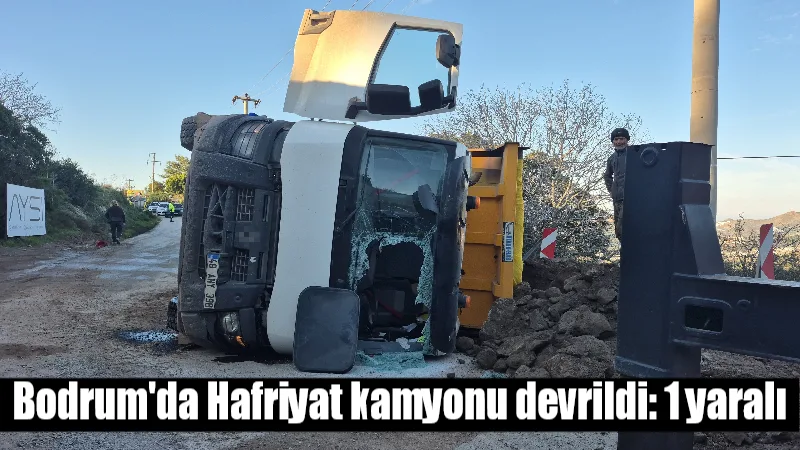 Muğla'nın Bodrum ilçesinde İ.E. yönetimindeki hafriyat kamyonu yol kenarındaki çukura