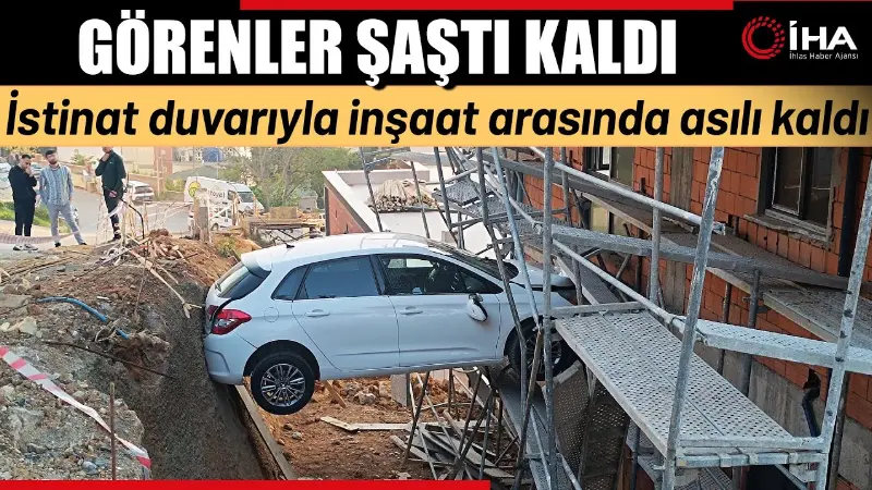 İstanbul-Kartal'da kontrolden çıkan otomobil istinat duvarı ile inşaat halindeki binanın