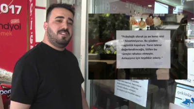 Antalya'da işlerinin durgunluğundan dolayı dükkanının camına "Psikolojik olarak kapalıyız" notu